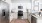 a kitchen with white cabinets