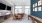 a clubroom with a tv, a table and chairs