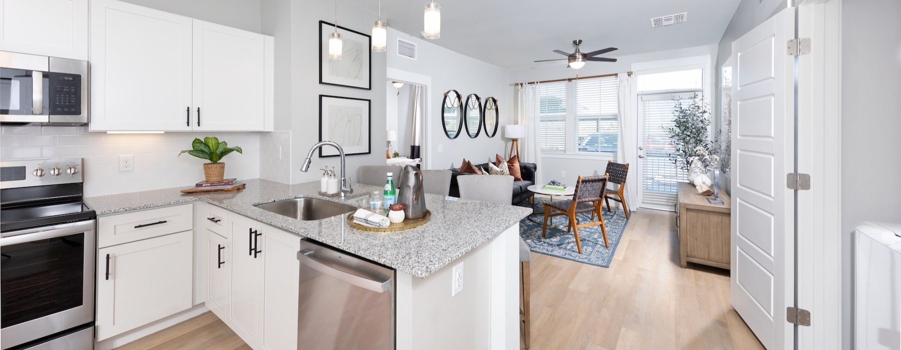 a kitchen with white cabinets