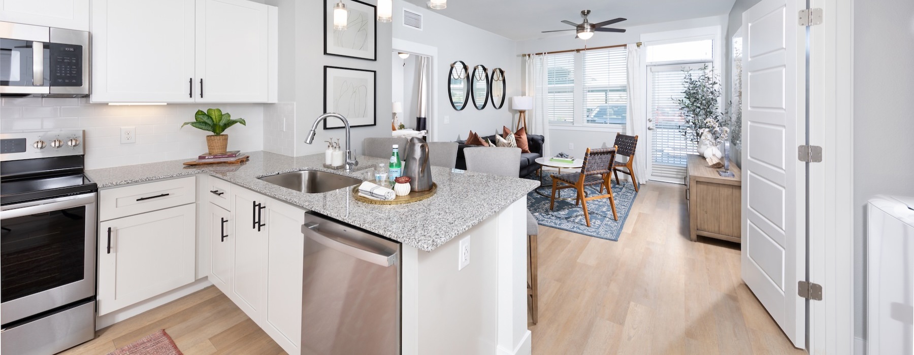 a kitchen with white cabinets