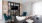 a living room with a tv, couch, chairs and a coffee table