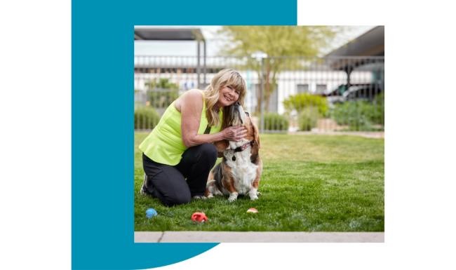 Mera Westgate is a pet-friendly community! a person kneeling down holding a dog